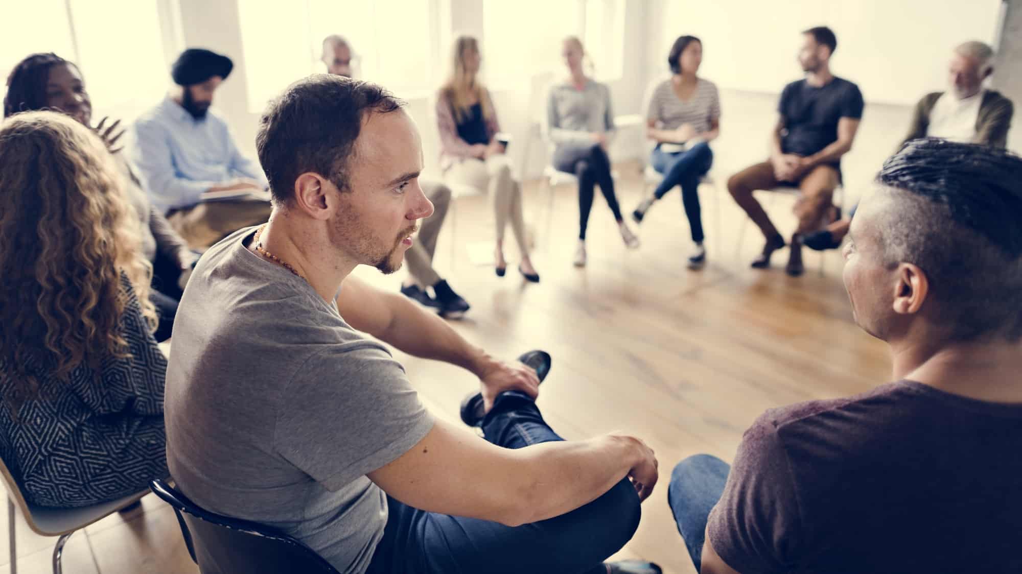 Group counseling Substance use counselor facilitating an addiction recovery group counseling session