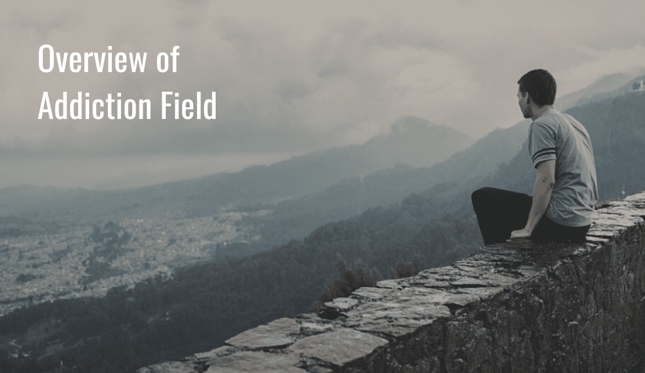 A man sits overlooking the valley and contemplates his online OASAS approved addiction counseling training.