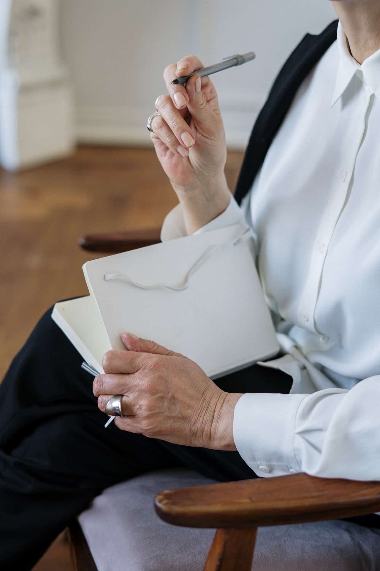A women sits at her computer taking notes as part of her self-paced drug counselor education