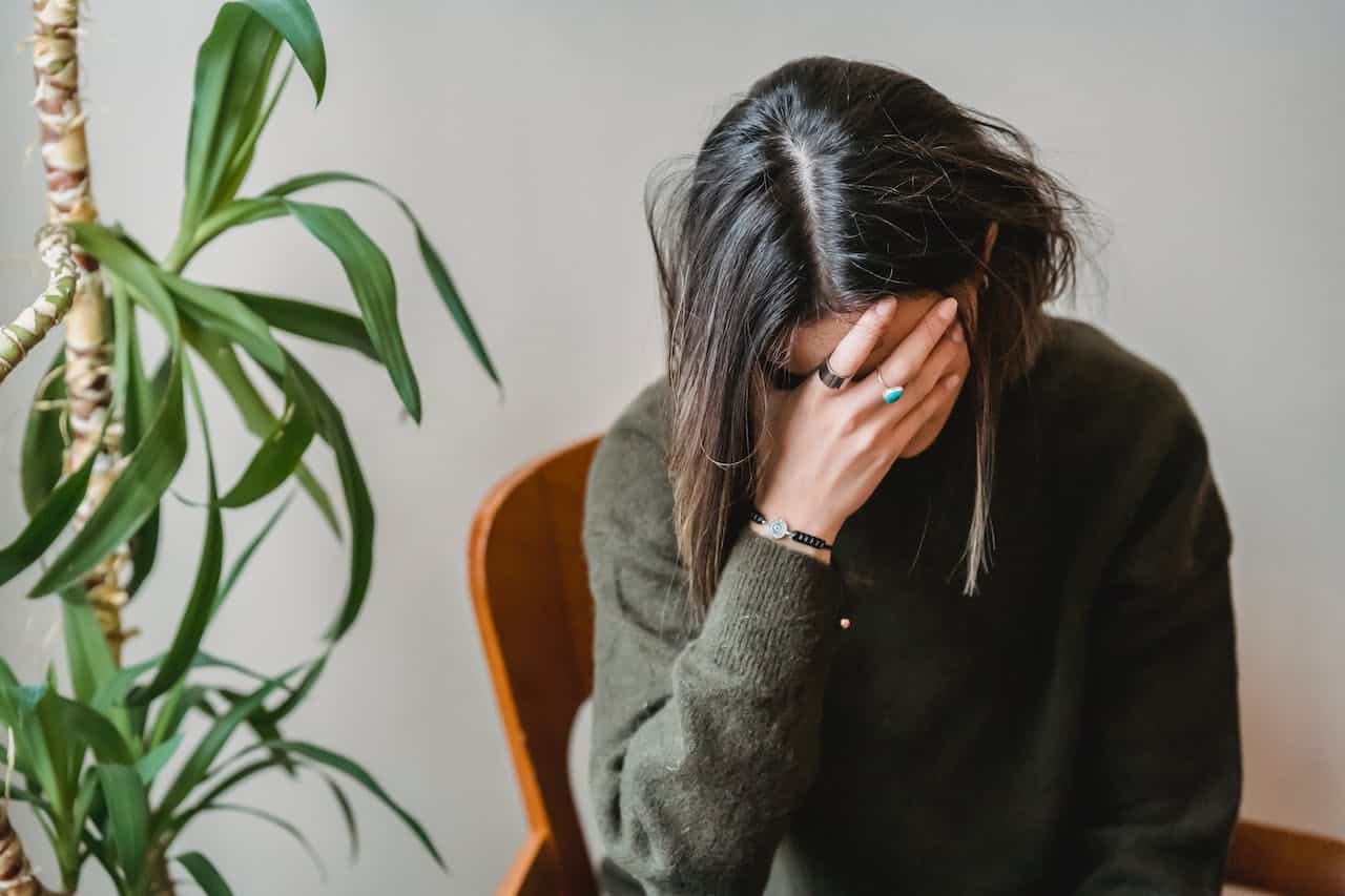 A women is processing her PTSD during a  drug counseling seeking safety  therapy session.