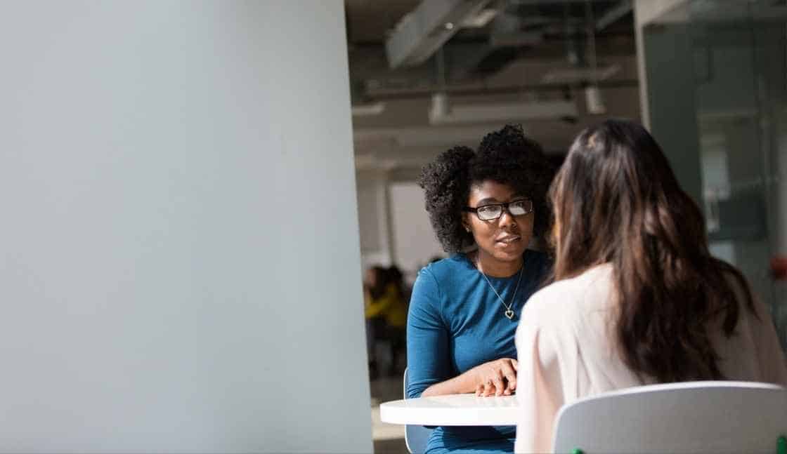 Two women discuss online CASAC training and how to form counselor/client relationships.