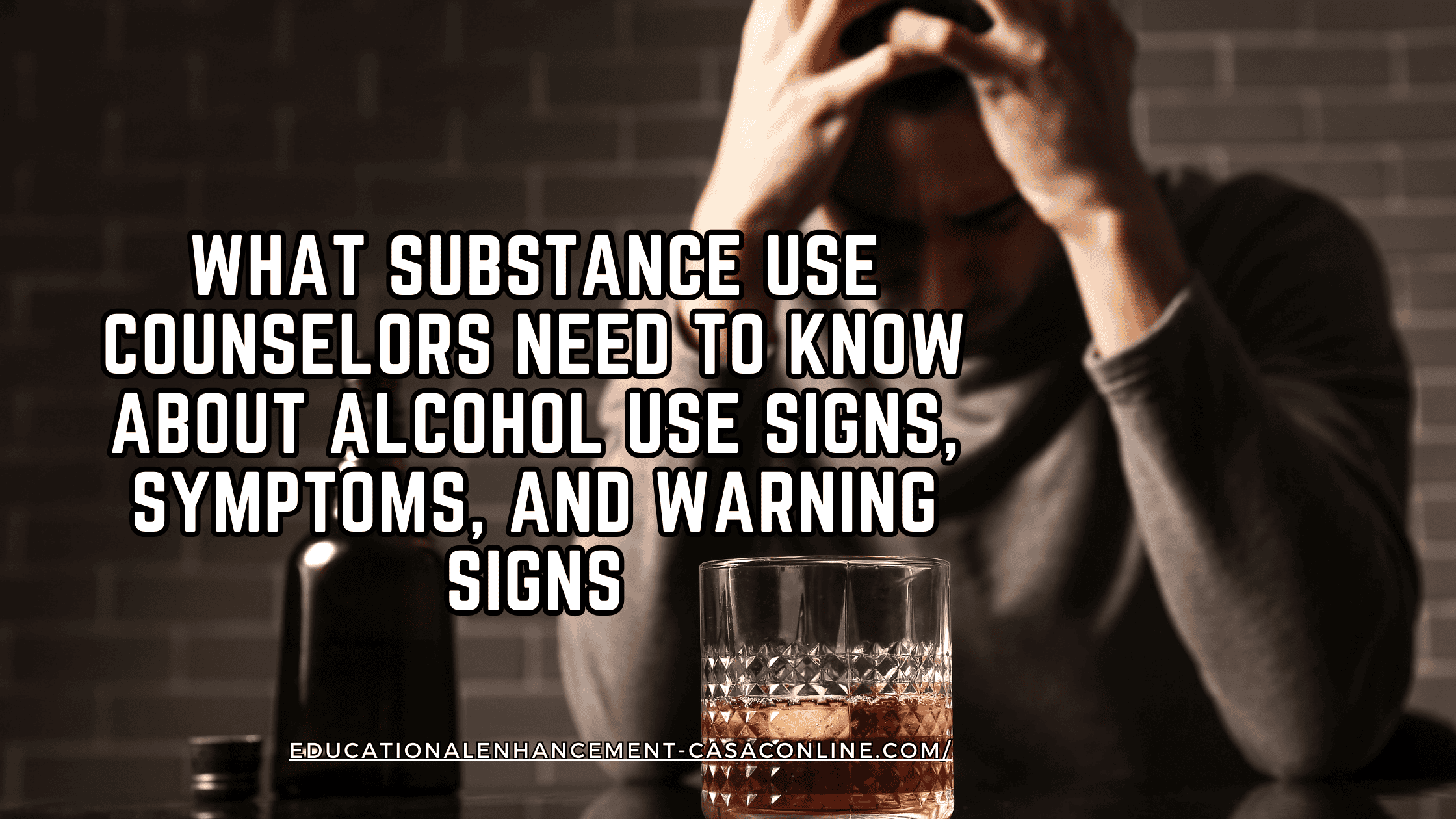 A distressed man sits at a table with his head in his hands beside a glass of whiskey and a bottle, representing visible distress linked to alcohol use disorder. The image highlights alcohol addiction warning signs, including physical and psychological warning signs of alcohol addiction, and underscores the need for early identification of alcohol addiction by substance use counselors.