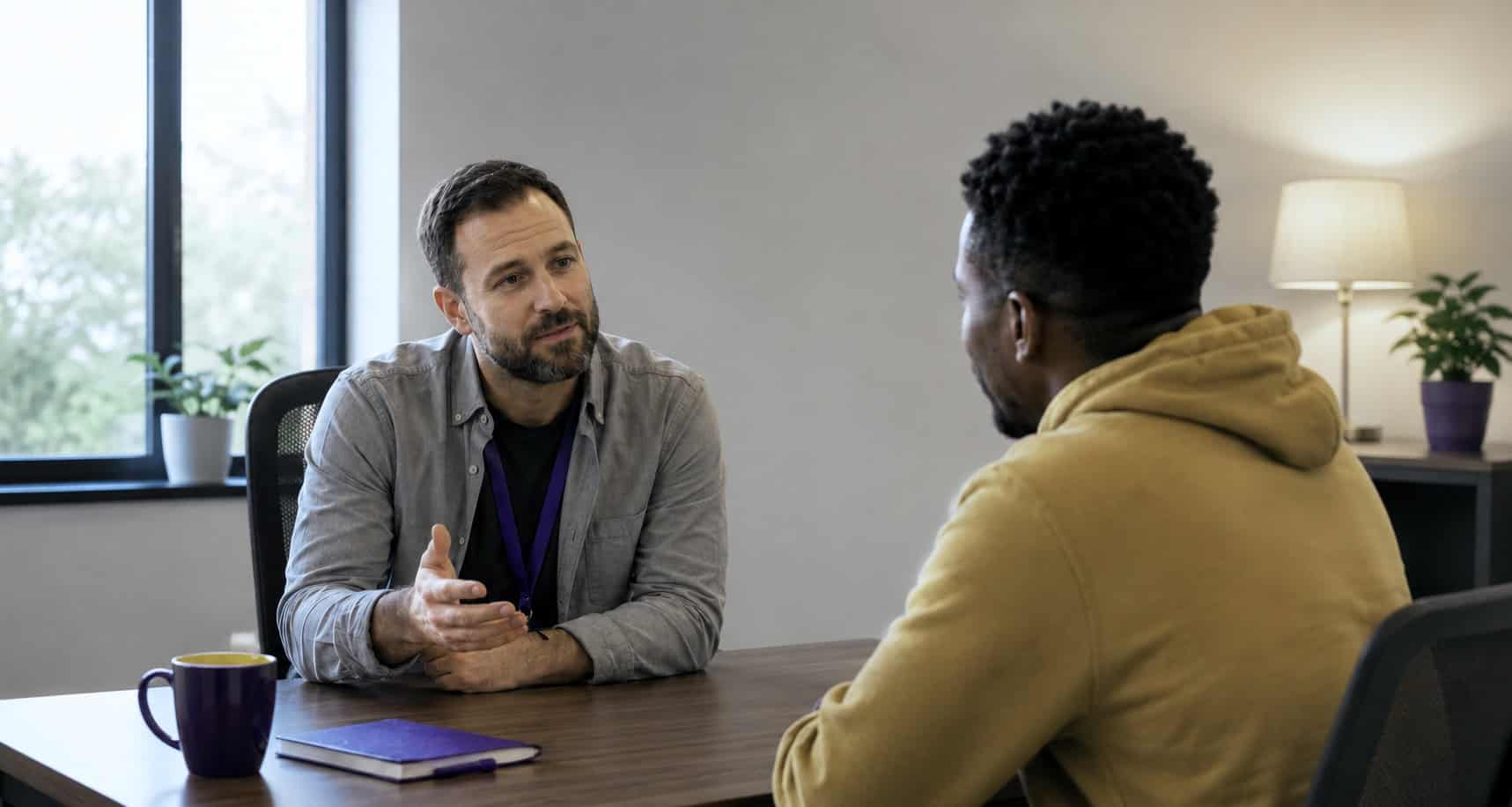 Substance use counselor meeting with a client during IC&RC ADC exam review training for CASAC exam prep and addiction counselor certification.